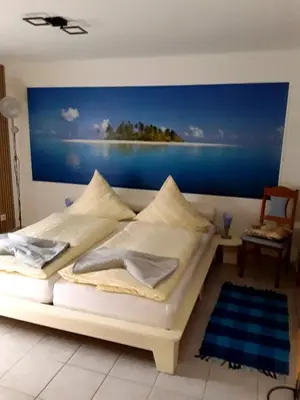 Ein Bett oder Betten in einem Zimmer der Unterkunft Pension Müller