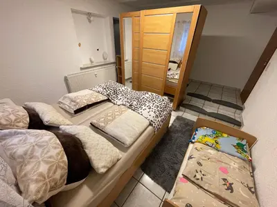 Ein Bett oder Betten in einem Zimmer der Unterkunft Ferienwohnung I&I