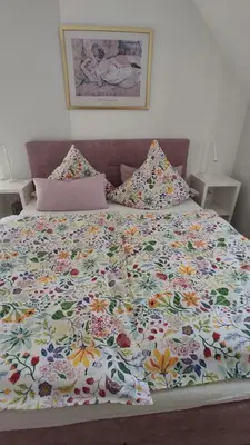 Ein Bett oder Betten in einem Zimmer der Unterkunft Ferienhaus Moselpanorama