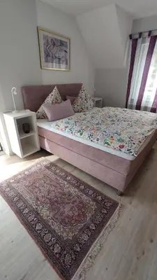 Ein Bett oder Betten in einem Zimmer der Unterkunft Ferienhaus Moselpanorama