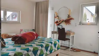 Ein Bett oder Betten in einem Zimmer der Unterkunft Studioraum nähe Koblenz