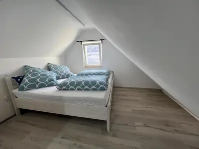 Ein Bett oder Betten in einem Zimmer der Unterkunft Winningen Ferienwohnung Beste Lage Terrasse