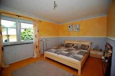 Ein Bett oder Betten in einem Zimmer der Unterkunft Bergkönig