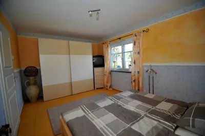 Ein Bett oder Betten in einem Zimmer der Unterkunft Bergkönig