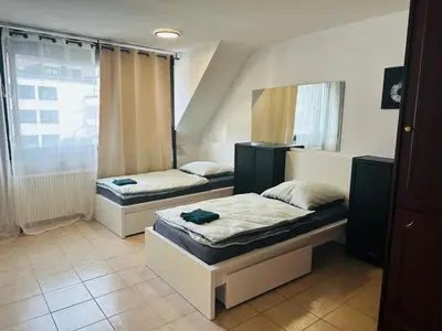 Ein Bett oder Betten in einem Zimmer der Unterkunft City Apartment Family & group