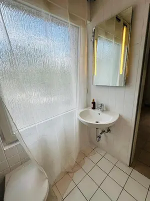Ein Badezimmer in der Unterkunft City Apartment Family & group