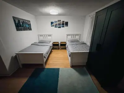 Ein Bett oder Betten in einem Zimmer der Unterkunft RheinOase mit Garten für Familien & Gruppen