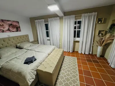 Ein Bett oder Betten in einem Zimmer der Unterkunft RheinOase mit Garten für Familien & Gruppen