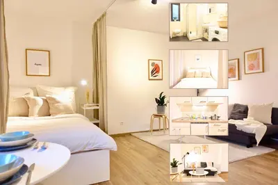 Ein Bett oder Betten in einem Zimmer der Unterkunft 2 stylische separate Apartments mit zwei privaten Stellplätzen für bis zu 8 Personen und stadtnah