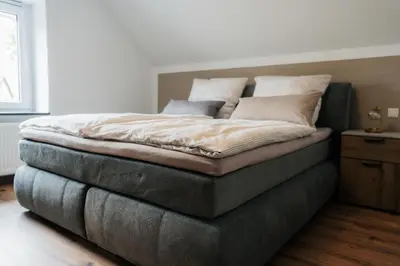 Ein Bett oder Betten in einem Zimmer der Unterkunft Ferienhaus Maarwinkel