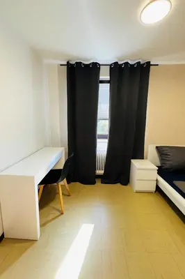 Ein Bett oder Betten in einem Zimmer der Unterkunft Helle 2-Zimmer Erdgeschosswohnung mit Terrasse