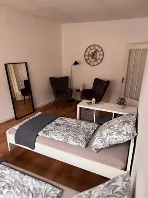 Ein Bett oder Betten in einem Zimmer der Unterkunft Stadtnest Mayen - stilvoll & zentral