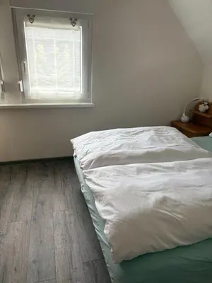 Ein Bett oder Betten in einem Zimmer der Unterkunft Das blaue Haus