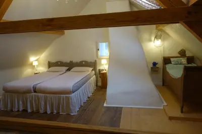 Ein Bett oder Betten in einem Zimmer der Unterkunft Ferienhaus Quers - ökologisches Ferienhaus in der Eifel