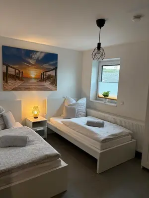 Ein Bett oder Betten in einem Zimmer der Unterkunft FeWo Mitte
