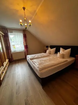 Ein Bett oder Betten in einem Zimmer der Unterkunft Hotel Bisenius