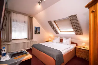 Ein Bett oder Betten in einem Zimmer der Unterkunft Hotel Bisenius