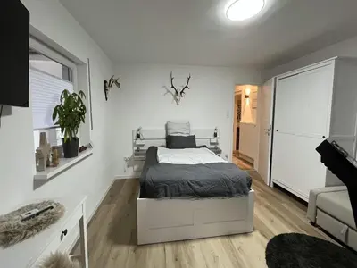 Ein Bett oder Betten in einem Zimmer der Unterkunft Guest rooms Eifelglück in Pelm