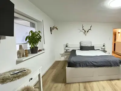 Ein Bett oder Betten in einem Zimmer der Unterkunft Guest rooms Eifelglück in Pelm