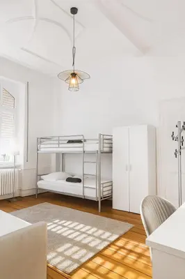 Ein Bett oder Betten in einem Zimmer der Unterkunft Villenflair trifft Citynähe