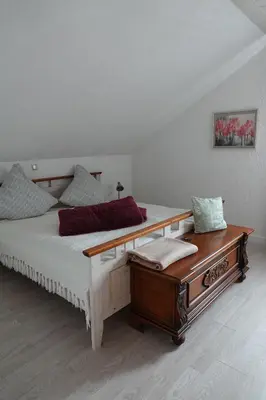 Ein Bett oder Betten in einem Zimmer der Unterkunft FeWo Luna - Wohnen am Tor zum Nationalpark Hunsrück-Hochwald