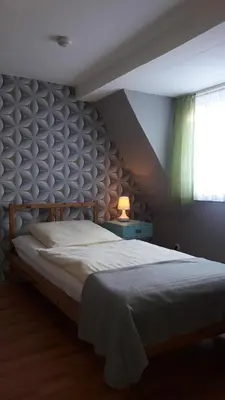 Ein Bett oder Betten in einem Zimmer der Unterkunft Haus des Handwerkers