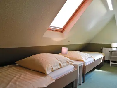 Ein Bett oder Betten in einem Zimmer der Unterkunft Haus des Handwerkers