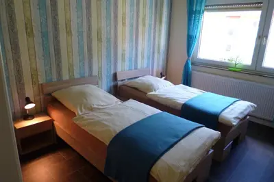 Ein Bett oder Betten in einem Zimmer der Unterkunft Ferienwohnung Koblenz City