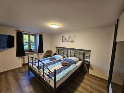 Ein Bett oder Betten in einem Zimmer der Unterkunft Old Winemaker's House Müntnich