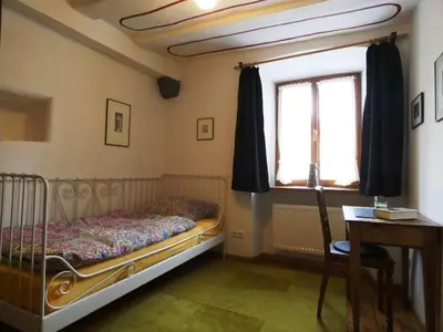 Ein Bett oder Betten in einem Zimmer der Unterkunft Old Winemaker's House Müntnich