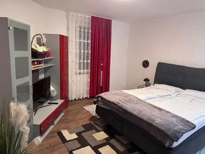Ein Bett oder Betten in einem Zimmer der Unterkunft DanMa Ferienwohnung Apartment-Gemeinschaftsküche