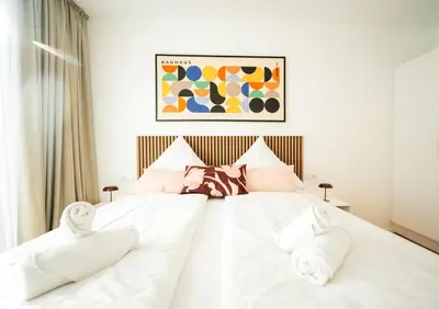 Ein Bett oder Betten in einem Zimmer der Unterkunft Inviting Flat Near City Center & The Mosel River