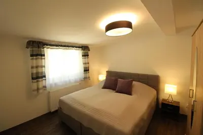 Ein Bett oder Betten in einem Zimmer der Unterkunft Palatium Bad Ems