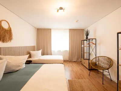 Ein Bett oder Betten in einem Zimmer der Unterkunft Palatium Bad Ems
