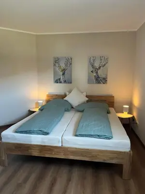 Ein Bett oder Betten in einem Zimmer der Unterkunft Ferienwohnung Pommerbachquelle