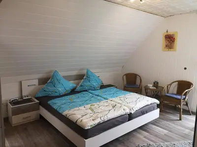 Ein Bett oder Betten in einem Zimmer der Unterkunft Gästehaus Spies