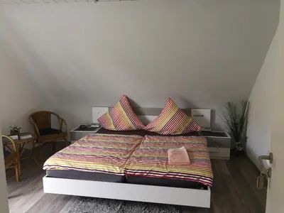 Ein Bett oder Betten in einem Zimmer der Unterkunft Gästehaus Spies