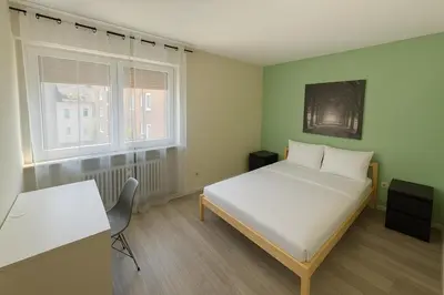 Ein Bett oder Betten in einem Zimmer der Unterkunft Family & Friends Residence