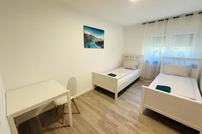 Ein Bett oder Betten in einem Zimmer der Unterkunft Family & Friends Residence