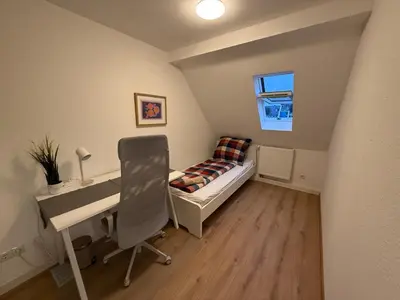 Ein Bett oder Betten in einem Zimmer der Unterkunft Zimmer direkt an dem Rheinsteig neben der WHU mitten im Zentrum von Vallendar