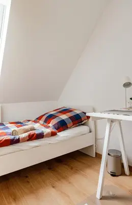 Ein Bett oder Betten in einem Zimmer der Unterkunft Zimmer direkt an dem Rheinsteig neben der WHU mitten im Zentrum von Vallendar