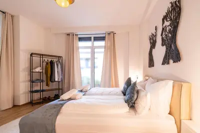 Ein Bett oder Betten in einem Zimmer der Unterkunft SALUS Living - Loft-Infrarotsauna-ruhiger Innenhof-Innenstadt
