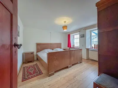 Ein Bett oder Betten in einem Zimmer der Unterkunft Der Lebendige Garten