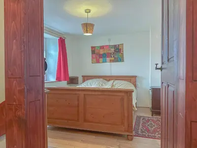 Ein Bett oder Betten in einem Zimmer der Unterkunft Der Lebendige Garten