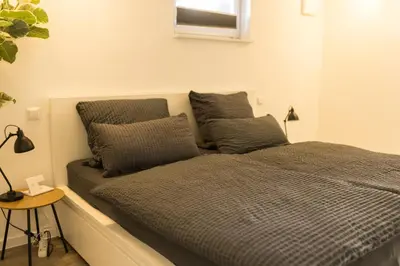 Ein Bett oder Betten in einem Zimmer der Unterkunft Moderne und gemütliche Ferienwohnung in Holzbach