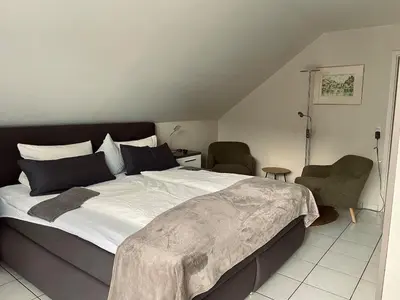 Ein Bett oder Betten in einem Zimmer der Unterkunft Burgunder Suite