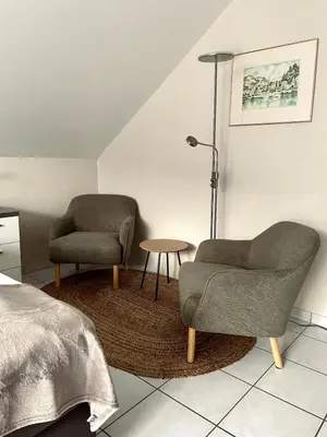 Ein Sitzbereich in der Unterkunft Burgunder Suite