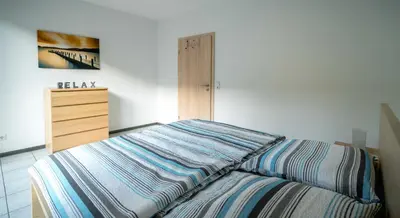 Ein Bett oder Betten in einem Zimmer der Unterkunft Moseltraum