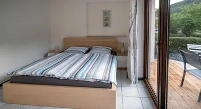 Ein Bett oder Betten in einem Zimmer der Unterkunft Moseltraum