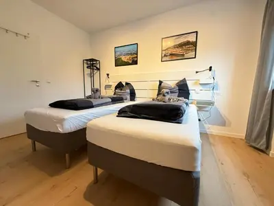 Ein Bett oder Betten in einem Zimmer der Unterkunft KO 3-Zimmer Apartment 73 qm bis zu 6 Personen